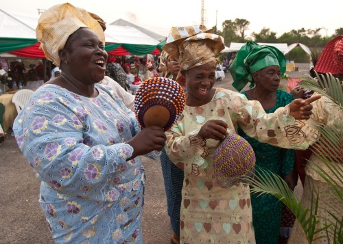 women playing sekere at a yoruba wedding